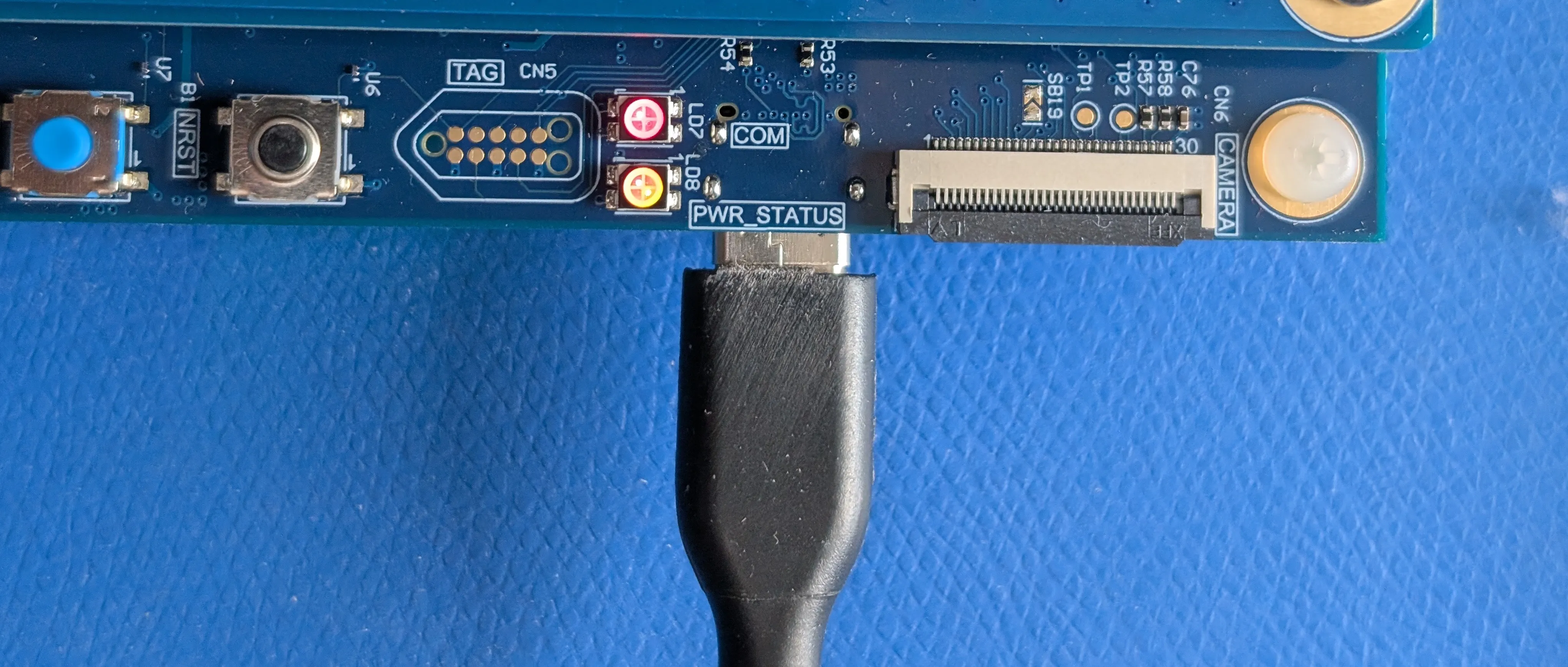 USB-C cable plugged into the PWR_STATUS port USB-C cable plugged into the PWR_STATUS port