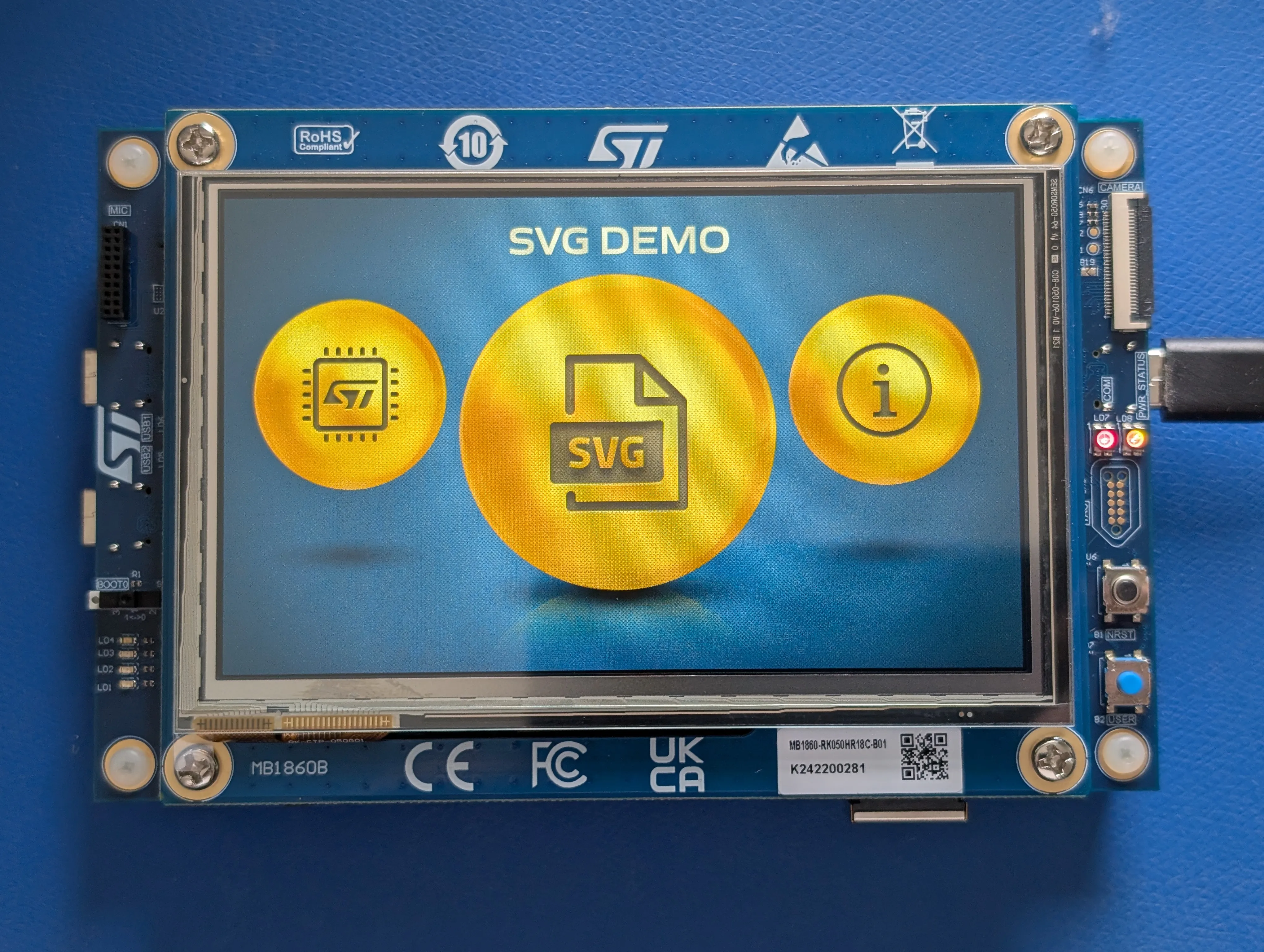 STM32H7S78-DK board's LCD screen displaying the SVG Demo