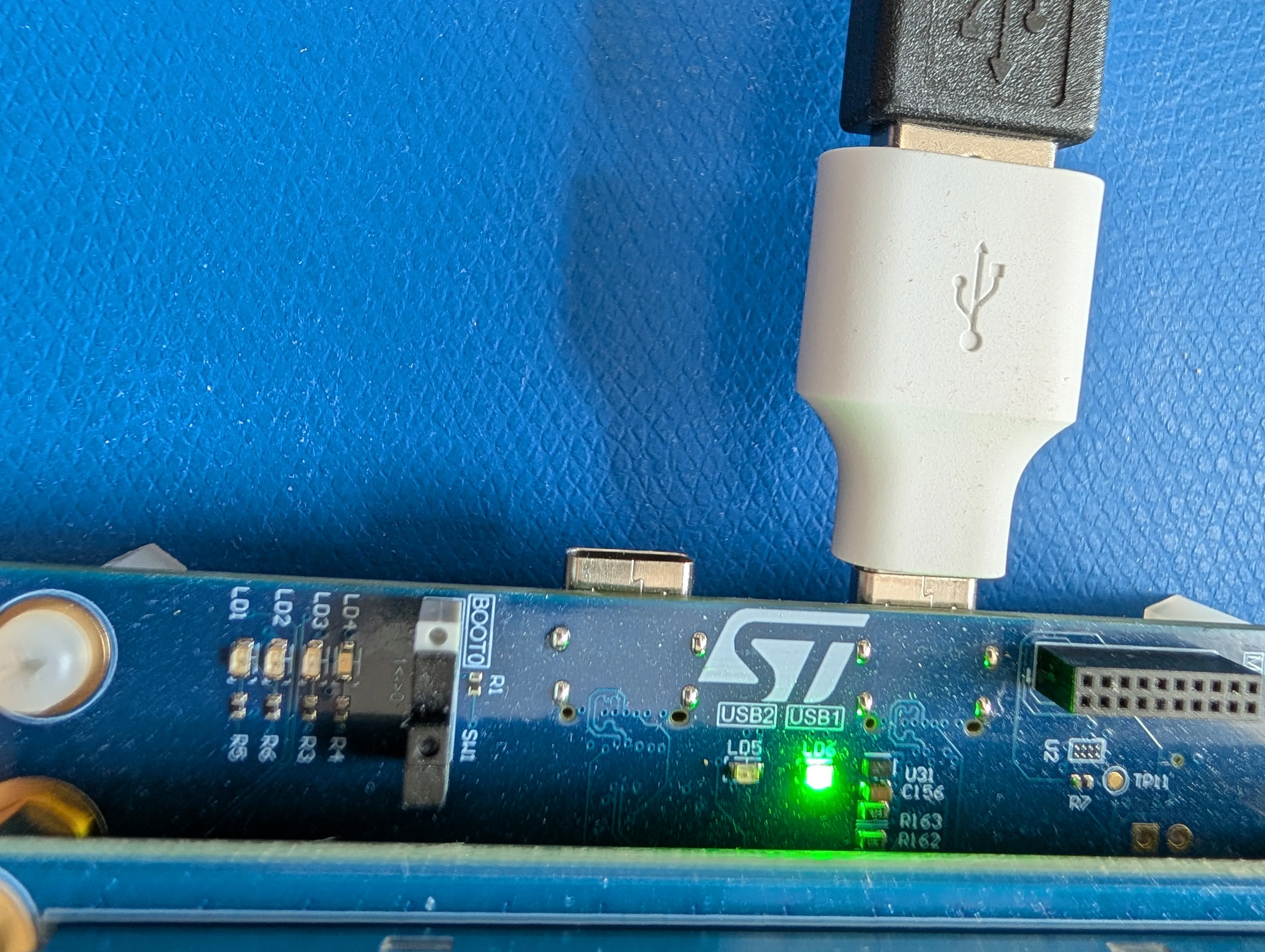 Keyboard plugging into the USB1 port via a USB-A-to-C adapter